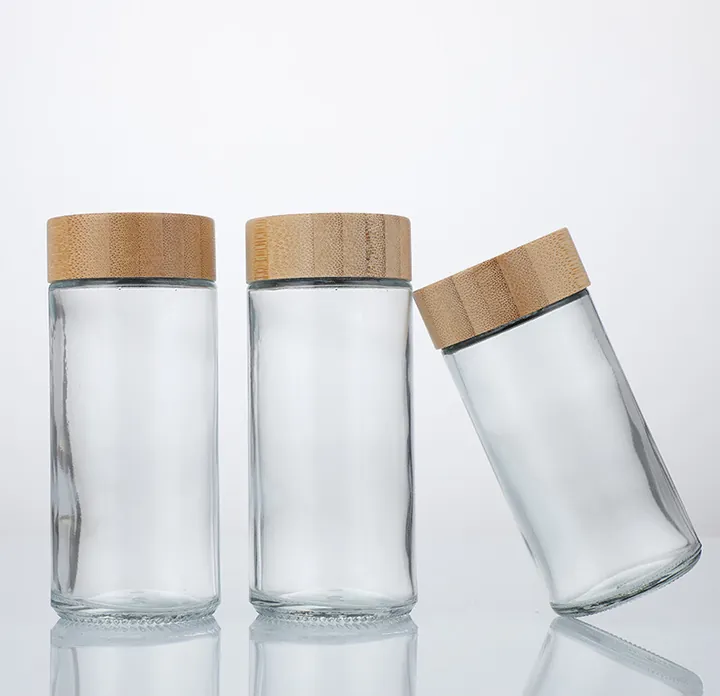 Three clear glass spice jars with bamboo lids