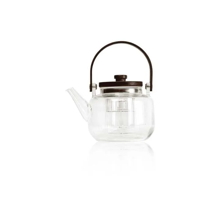 Théière en verre transparent nervuré, avec une anse et un couvercle arqués de couleur foncée