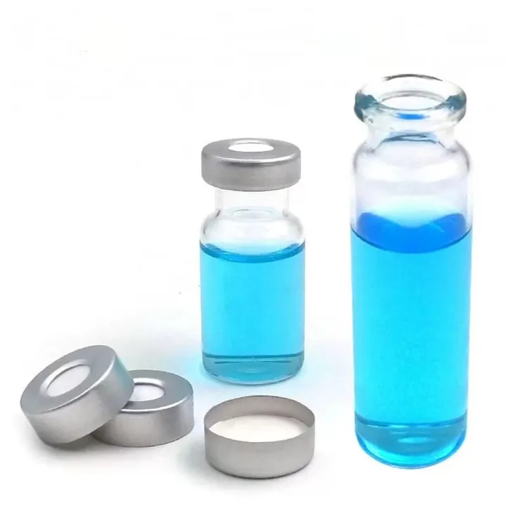 Clear glass vial with silver aluminum cap and blue liquid