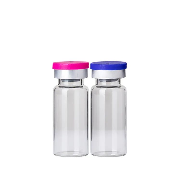 Two clear glass vials with colored aluminum plastic caps