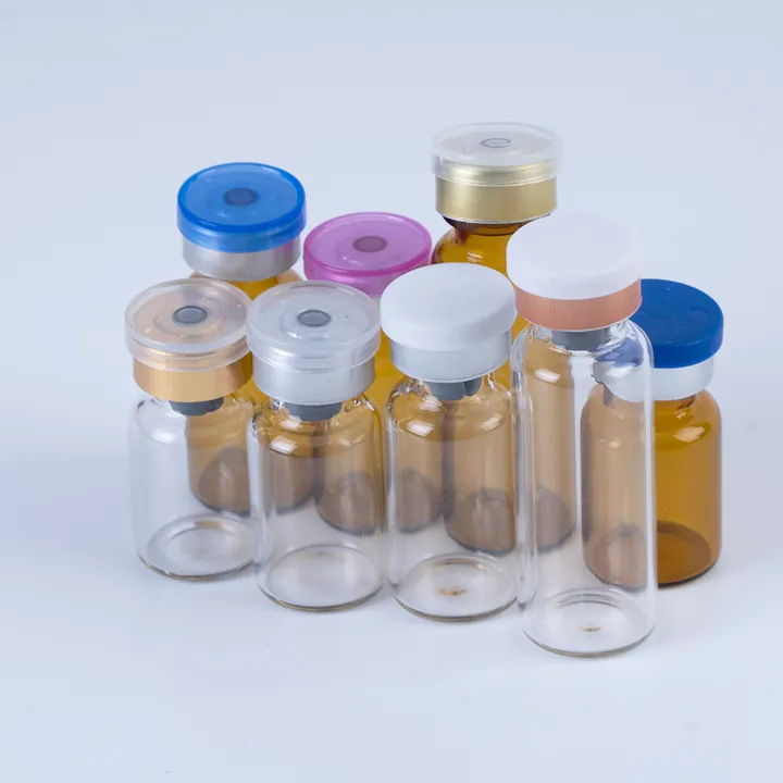 Clear and amber glass vials with different colored caps
