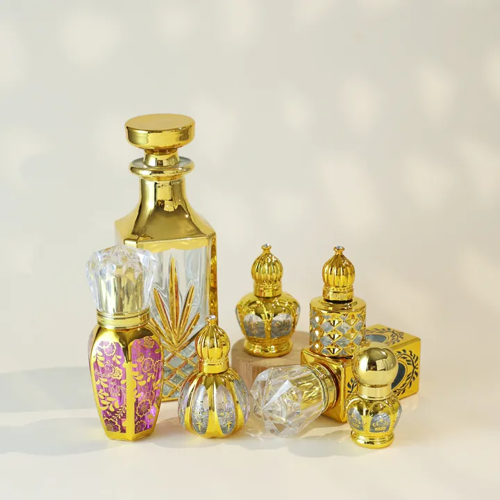 Gold decorated perfume bottles in round square and crystal cap styles