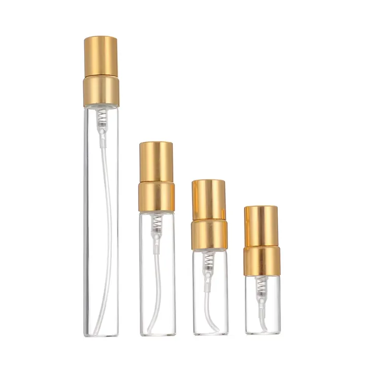 Clear perfume sample spray bottles with gold sprayers in different heights