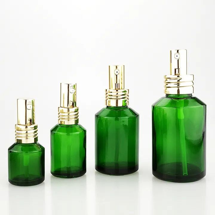 Botellas pulverizadoras de cristal verde en distintos tamaños