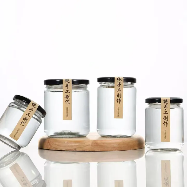 Square glass jam jars with black lids and label tags