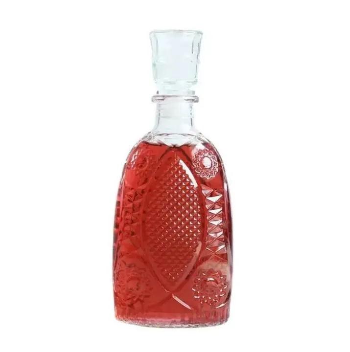 Round shoulder glass liquor bottle with embossed floral pattern and clear stopper