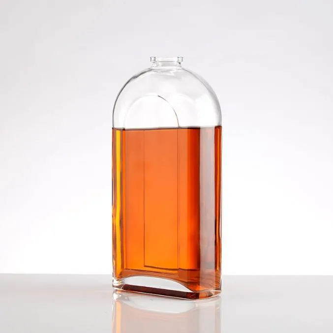 Round shoulder liquor bottle with recessed arched structure and amber liquid