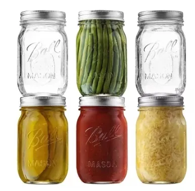 Embossed mason jars filled with different preserved foods