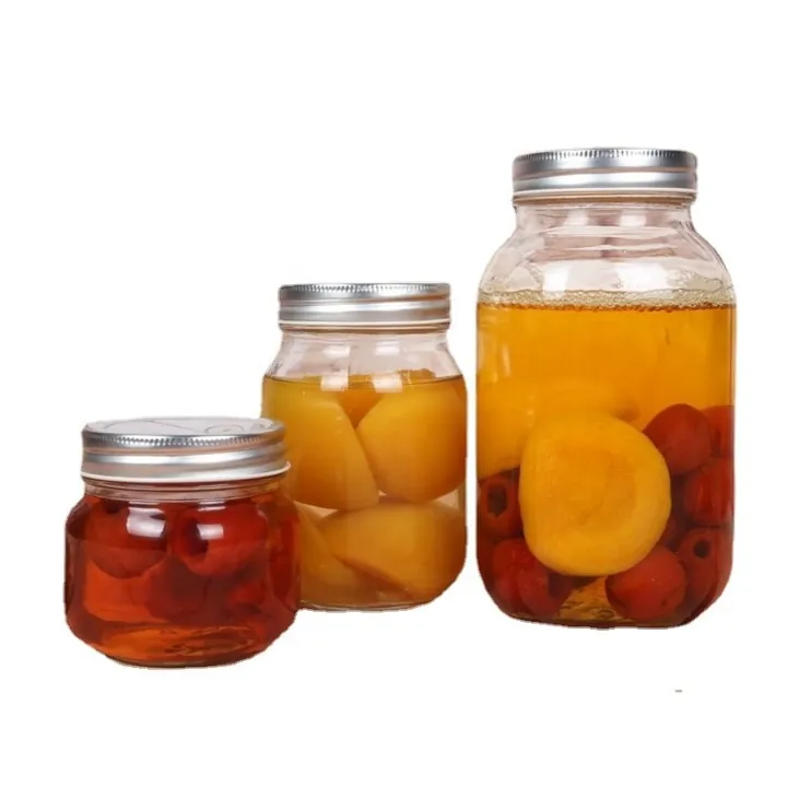 Clear mason jars filled with preserved fruit