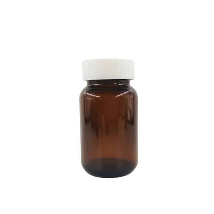 Amber medicine bottle with white screw cap
