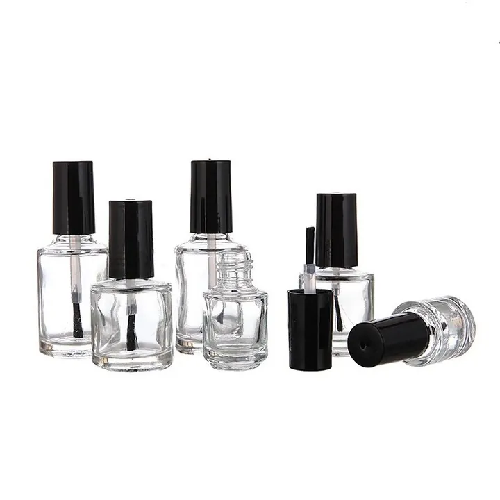 Clear nail polish bottles with black caps and brush applicators
