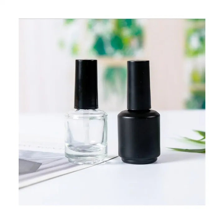 Two round nail polish bottles in transparent and black finishes