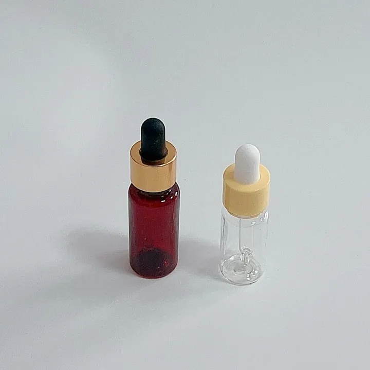 Small amber and clear glass dropper bottles