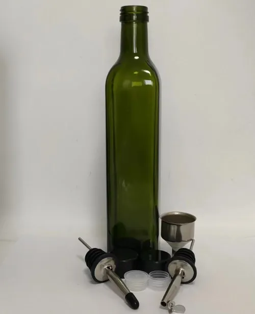 Green olive oil bottle with pourer and cap accessories