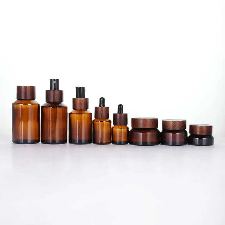 Amber bottles and cream jars with matching wood grain lids
