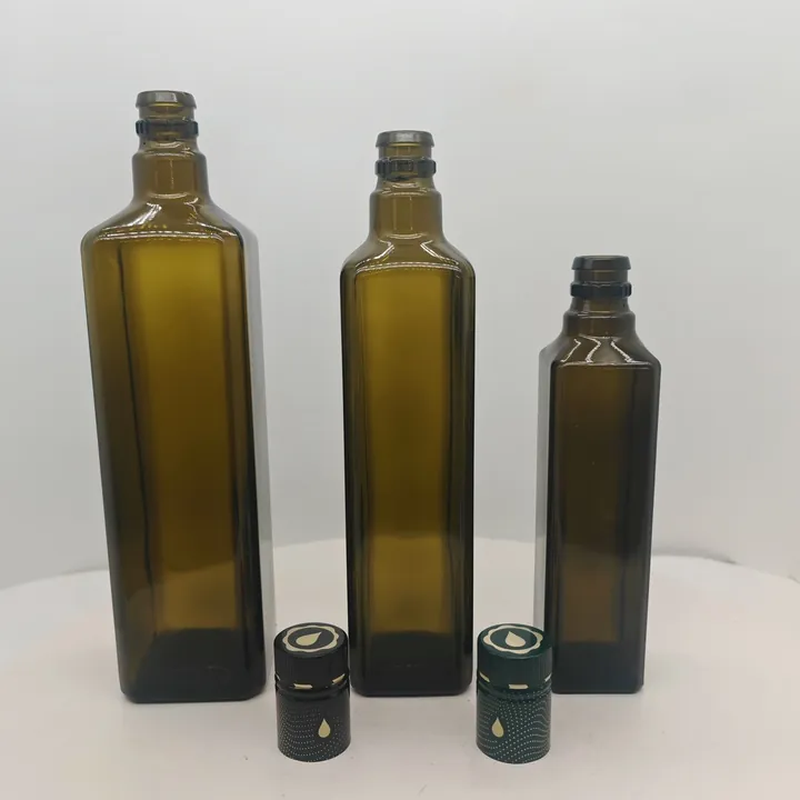Green square olive oil bottles with decorative cap logo design