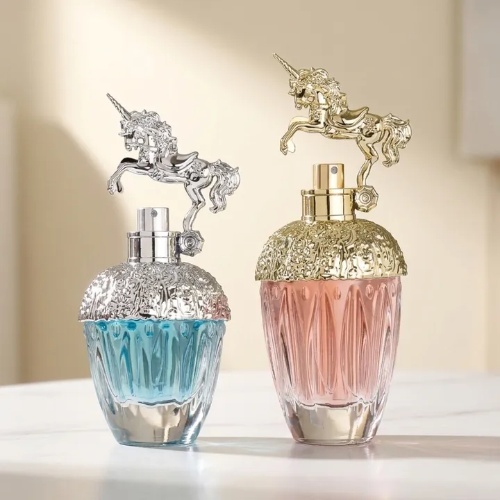Blue and pink perfume glass bottles with unicorn shaped caps