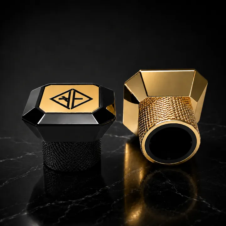 Black and gold geometric perfume bottle cap with logo