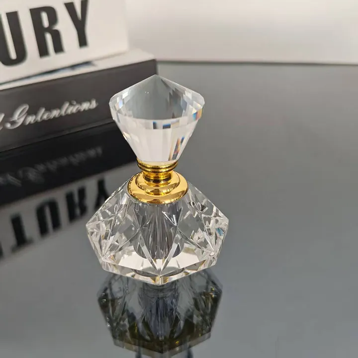 Crystal cut perfume oil bottle with gold neck ring