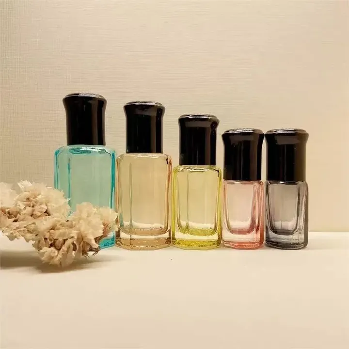 Five mini square perfume oil bottles with black caps