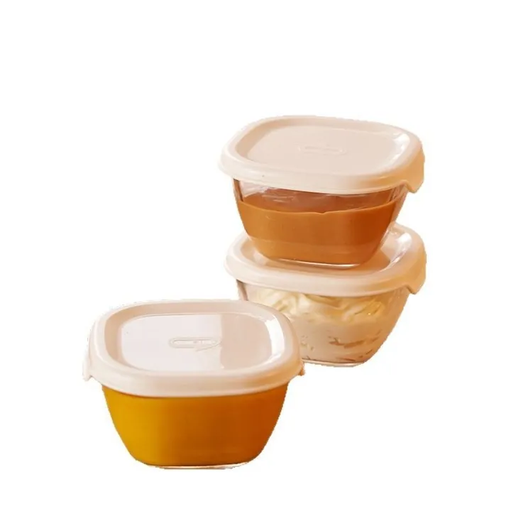Three square glass storage bowls with white sealing lids