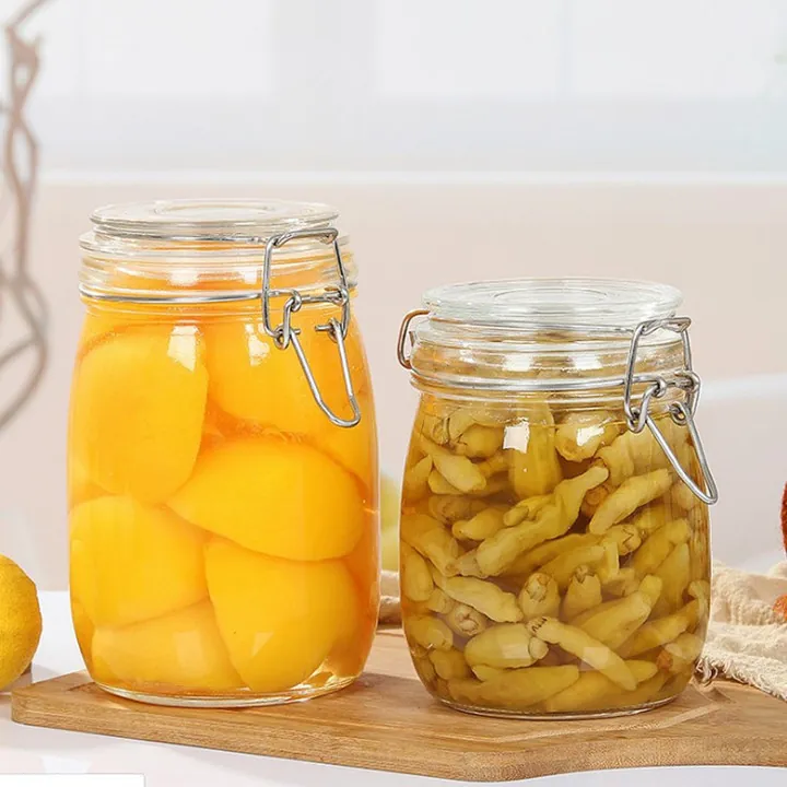 Two clip top glass jars filled with pickled food