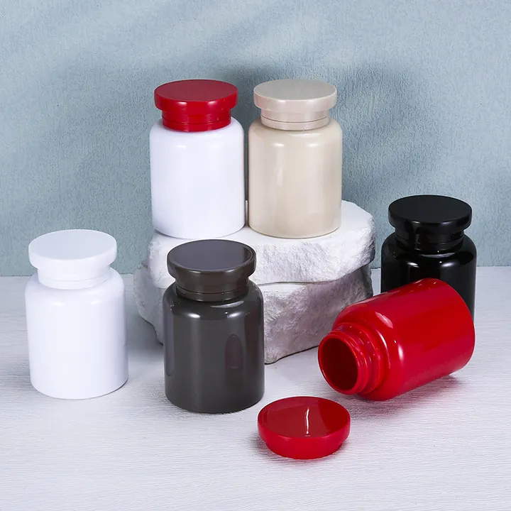 Plastic prescription bottles in red black white and semi transparent