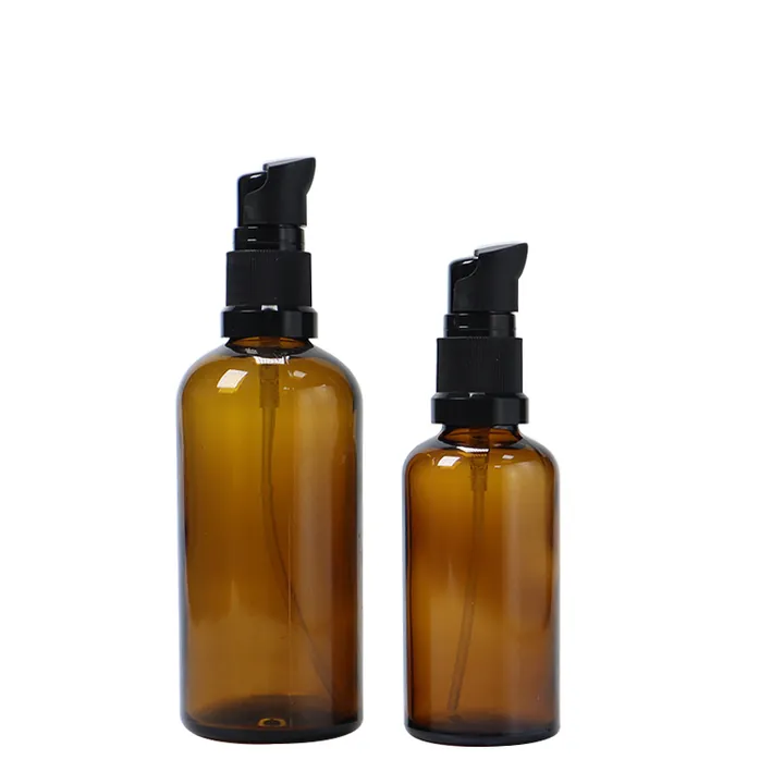 Two amber serum pump bottles with black pump tops