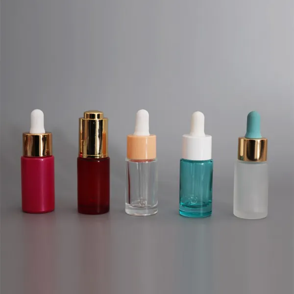 Mini serum dropper bottles in red, clear, teal and frosted finishes