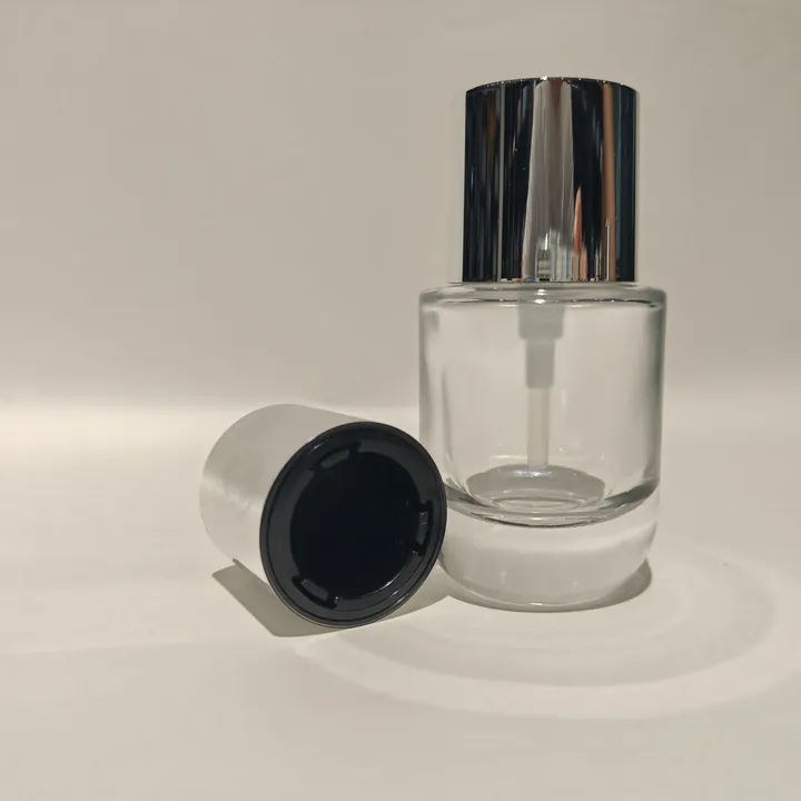 Clear thick bottom serum pump bottle with silver cap