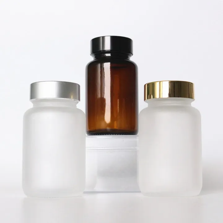 Frosted supplement bottles in white and amber finishes