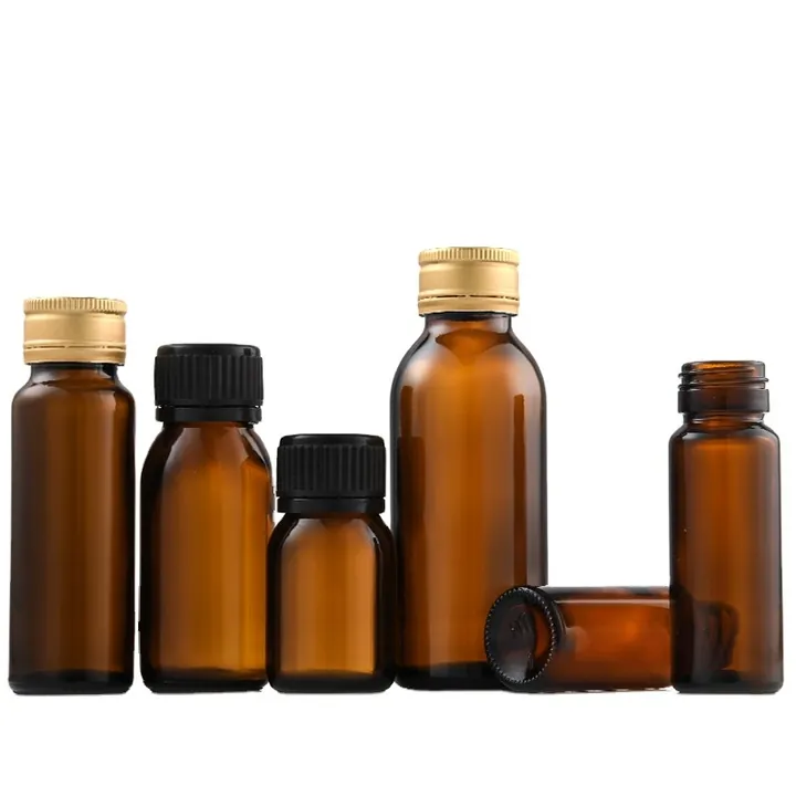 Amber medicine syrup bottles with gold and black caps