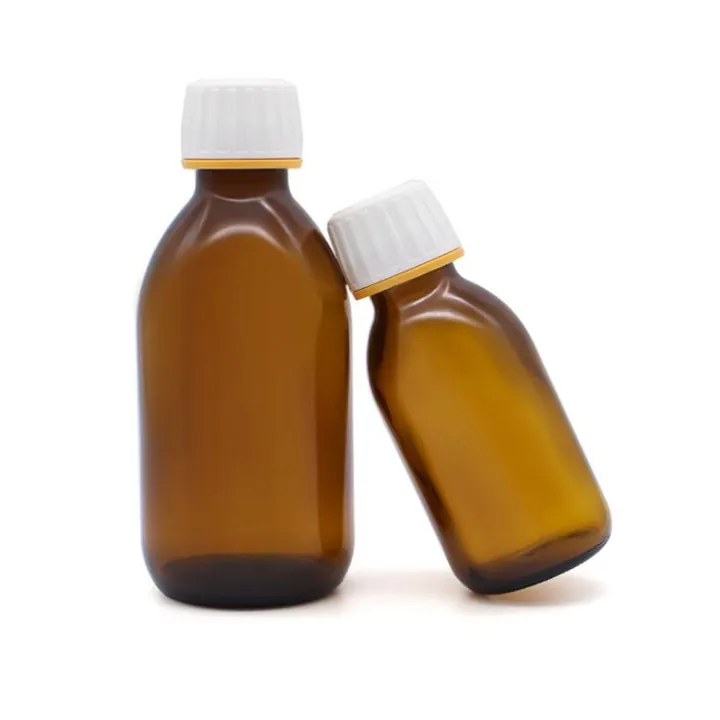 Two amber round shoulder syrup bottles with white tamper evident caps