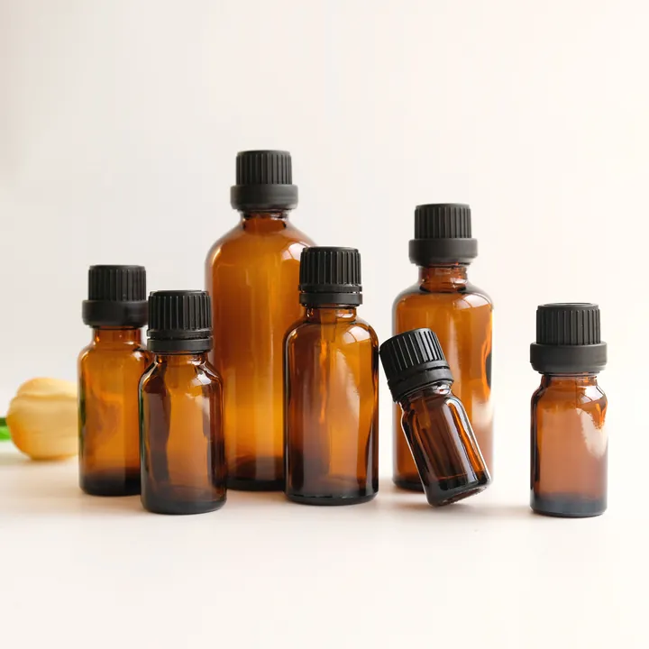 Amber glass tincture bottles with screw cap closures