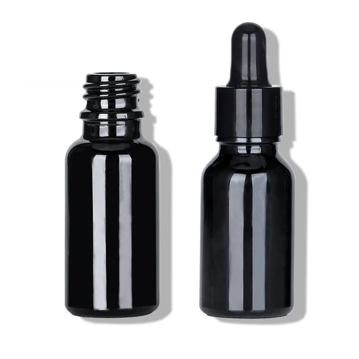 Black glass tincture bottles with dropper and screw cap