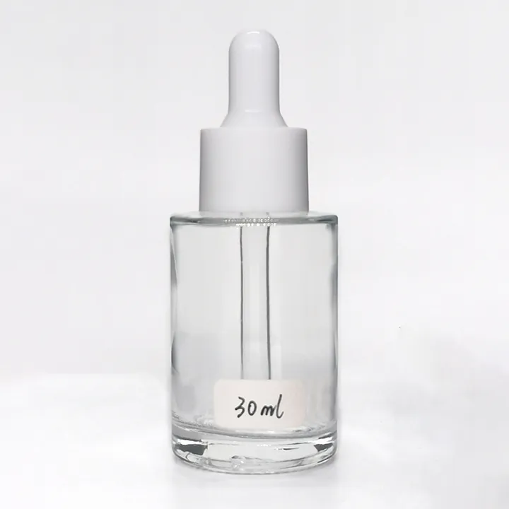 Clear glass tincture bottle with white dropper cap