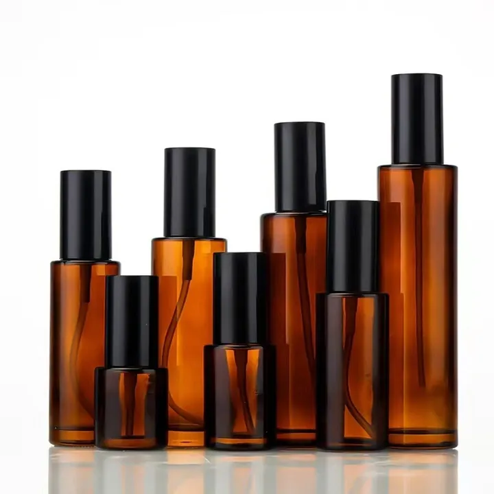 Multiple amber glass spray bottles in different heights
