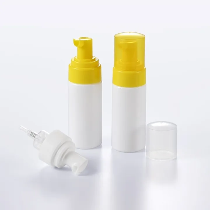 Compact foam pump bottle with yellow dispensing head