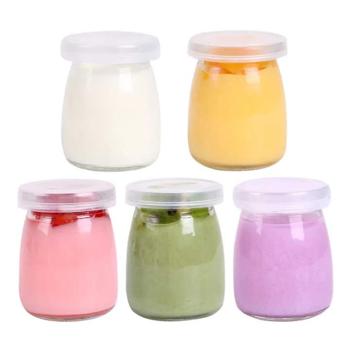 Five round yoghurt glass jars with different colored contents