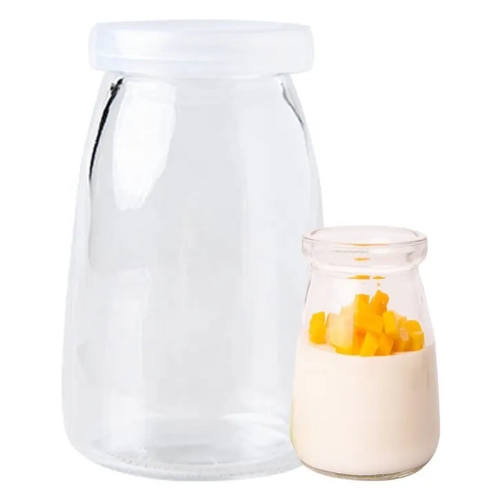 Glass yogurt jar and small pudding jar with plastic lids